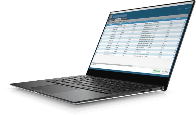 A laptop displaying a spreadsheet with rows and columns of data on its screen, viewed from a front-right angle.