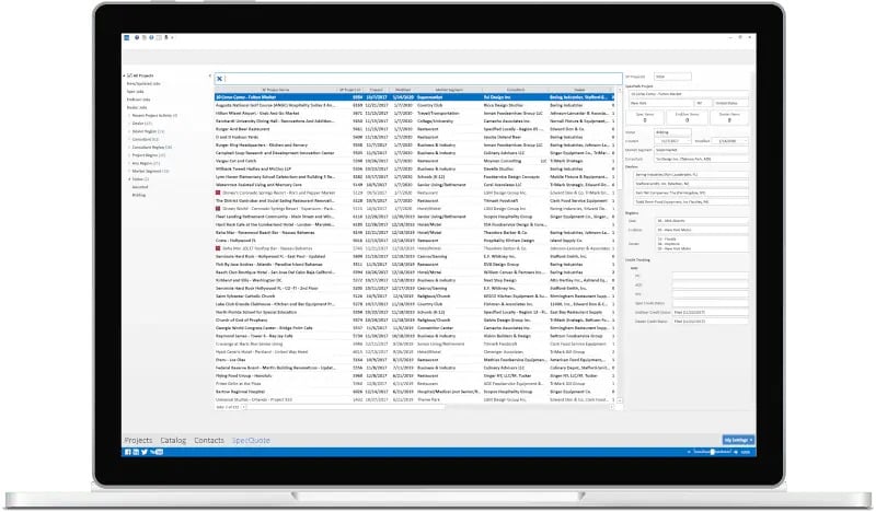 A laptop screen displaying a software interface with a detailed table of project data, including columns for project names, dates, and statuses.